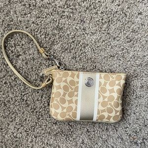 Gold coach wristlet